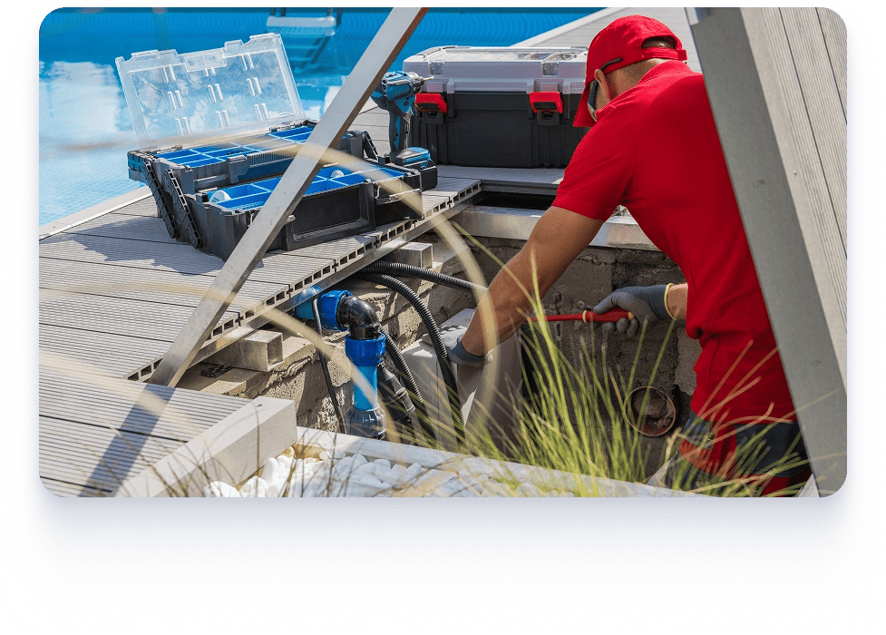A pool expert wearing a red shirt is engaged in pool equipment upgrades and automation.