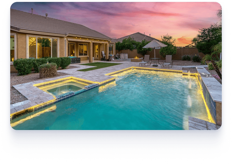 A backyard featuring a pool and patio area, showcasing Aspire Pools & Outdoors' design expertise in Austin and Houston.