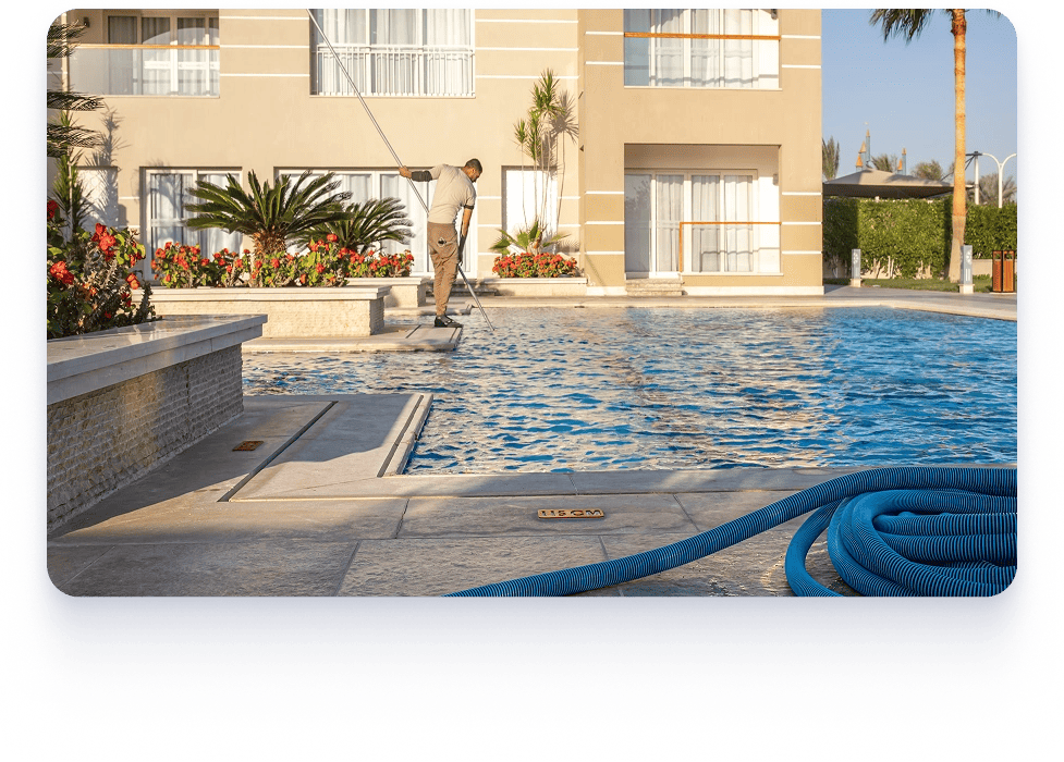 A pool scene with a hose connected, representing equipment for pool cleaning and weekly upkeep.