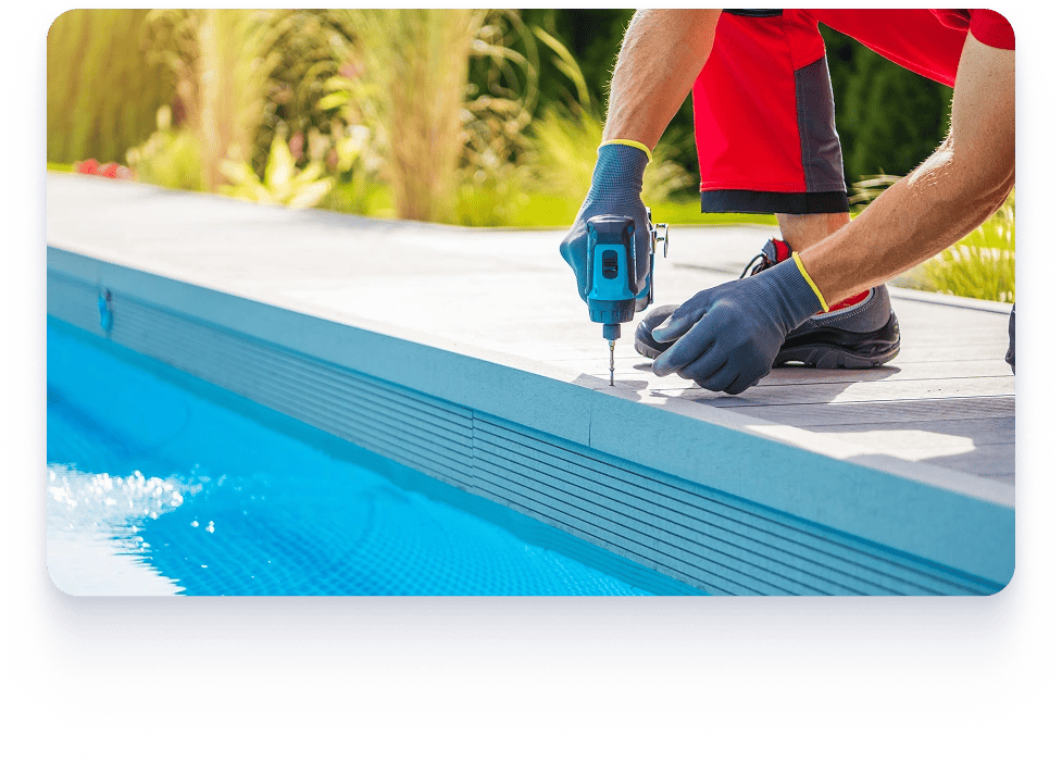 A man drills to install a pool liner during repairs in Texas, focusing on precise placement for a secure fit. Pool repair expert in Texas.