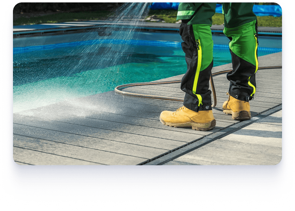  A person in yellow boots and green pants cleans a pool, promoting storm and seasonal maintenance services.